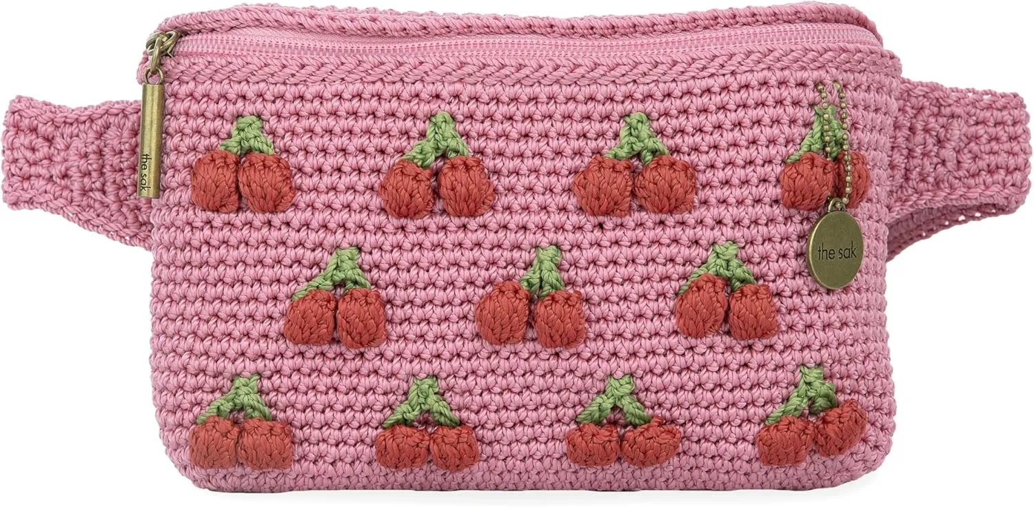 The Sak Caraway Belt Bag in Crochet, Adjustable Back Strap, Pink Cherries